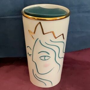 Starbucks siren face with crown ceramic travel mug.